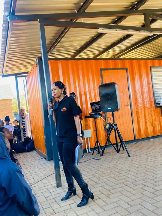 Linah Mnisi speaking during a community programme